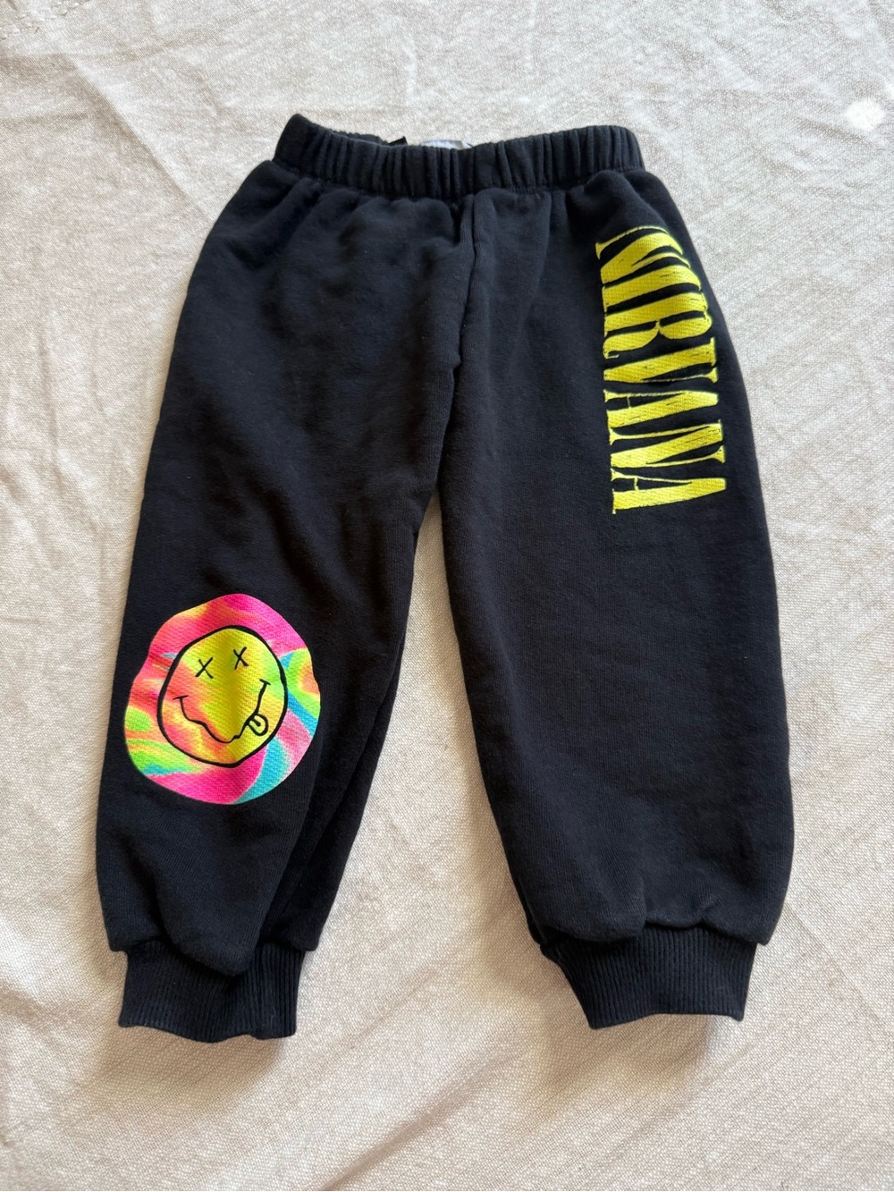 NIRVANA Black Sweatpants with Yellow Logo and Multicolor Tie-Dye Smiley